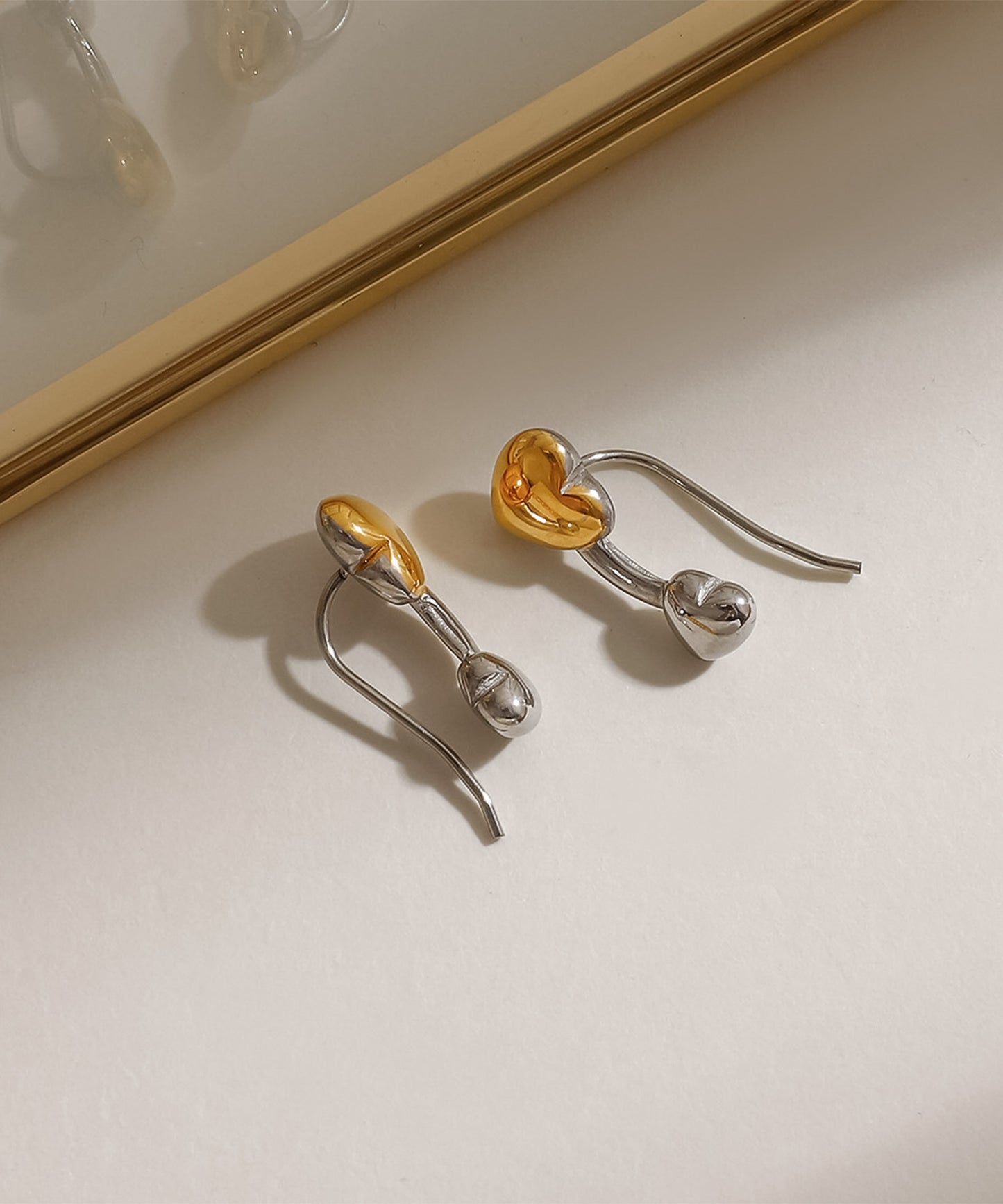 blackdia ocean バイカラーハートピアス